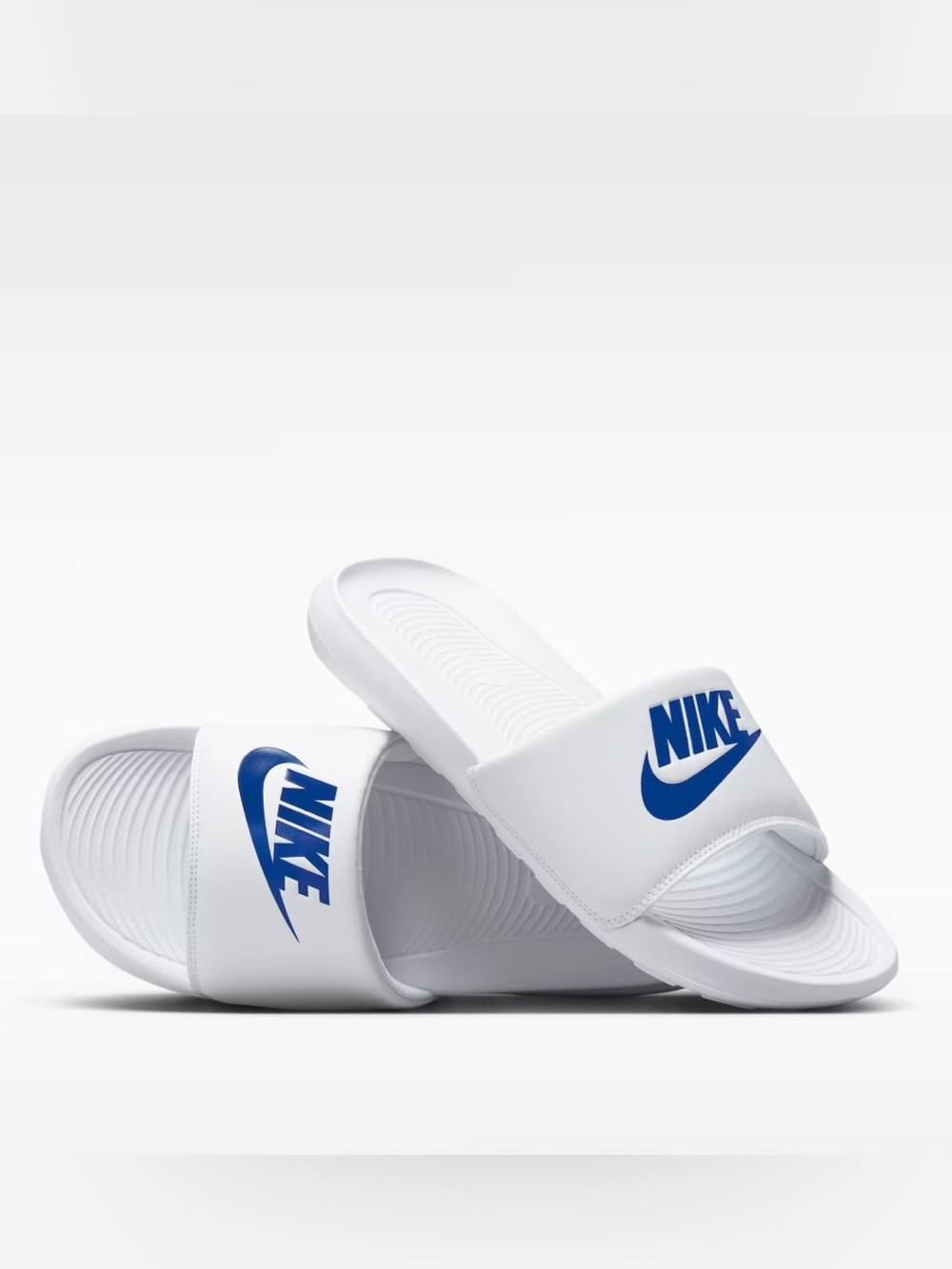 Brand NEW in box. Never worn. Nike White Slide Sandals with Blue Swoosh